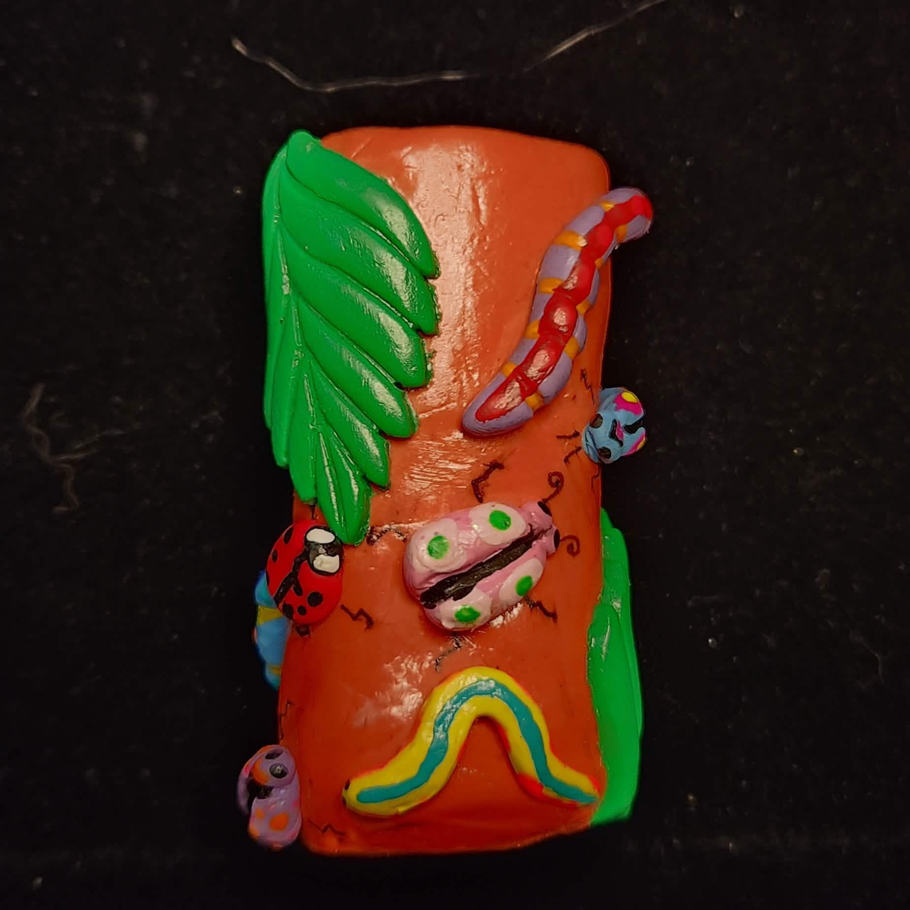 Orange Forest Grub Lighter Case - Wrapped Pebbles